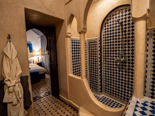 a bathroom with a shower and a toilet in a room at Riad Casa Lalla in Marrakesh