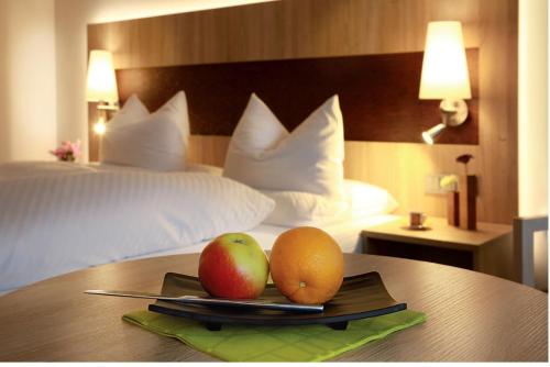 Ένα ή περισσότερα κρεβάτια σε δωμάτιο στο Hotel Schwarzwaldhof