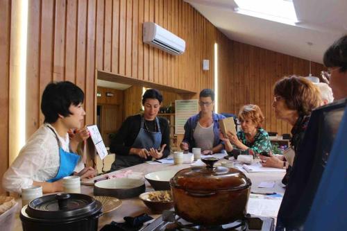 a group of people sitting around a table at Azumino Salon in Azumino