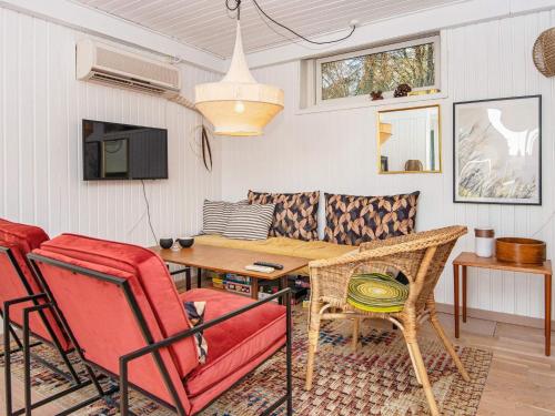 a living room with a table and chairs at 6 person holiday home in Silkeborg-By Traum in Silkeborg