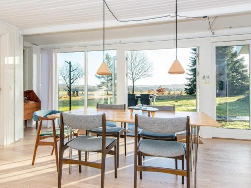 a dining room with a table and chairs at 6 person holiday home in Silkeborg-By Traum in Silkeborg