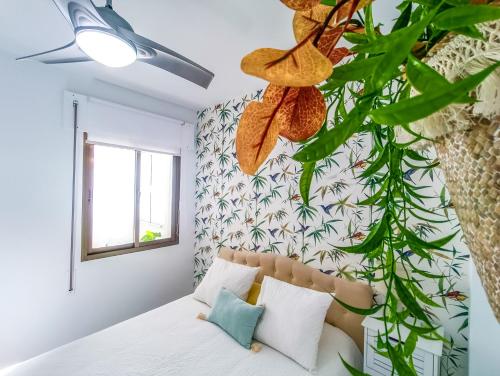 Postel nebo postele na pokoji v ubytování Vistahermosa Palm