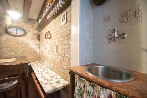 a bathroom with a sink and a table and a counter at Ca' Rielo in Venice