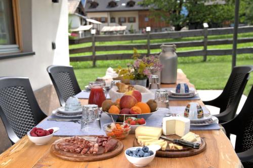 a wooden table with food on top of it at Mas dei Masi in Cavalese