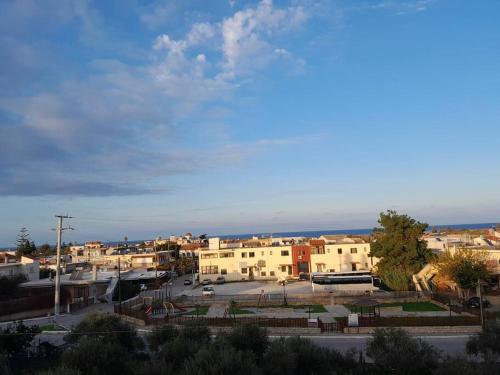 a view of a town with a parking lot at Salavantinas House in Tavronitis