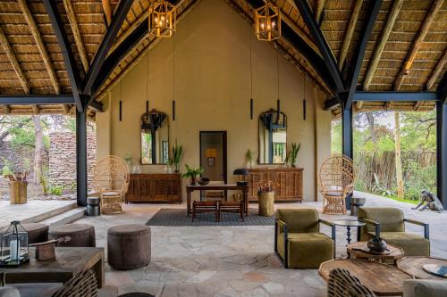 a large room with a table and chairs at Thornybush Game Lodge in Thornybush Game Reserve