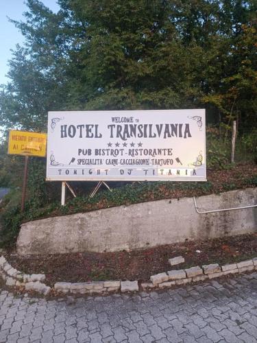 a sign for a hotel in transylvania sidx sidx sidx sidx at Hotel Transilvania in Pian del Voglio
