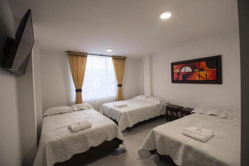 Postel nebo postele na pokoji v ubytování HYG Hotel