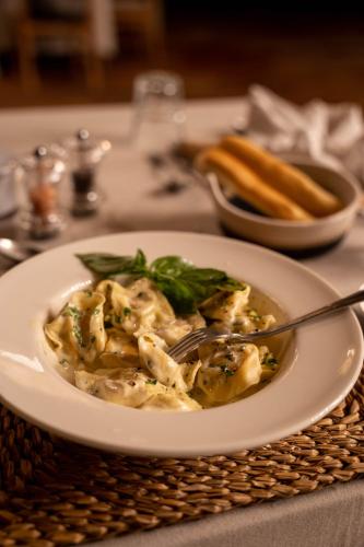 a plate of food on a table with a bowl of food at Thornybush Game Lodge in Thornybush Game Reserve