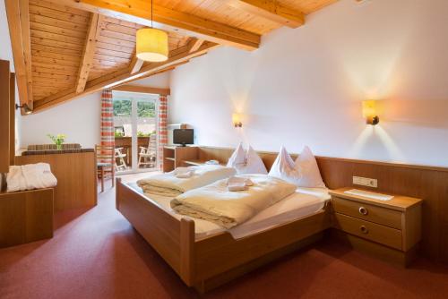 Postel nebo postele na pokoji v ubytování Hotel Klotz
