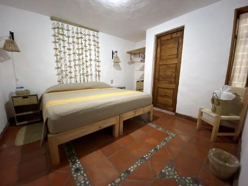 Postel nebo postele na pokoji v ubytování Posada El Palomar