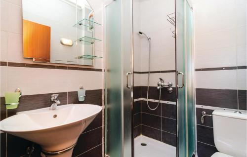 a bathroom with a sink and a shower at Awesome Apartment In Baosici With 3 Bedrooms And Wifi in Herceg-Novi