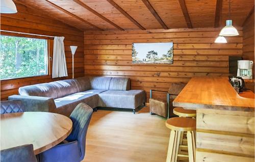 a living room with a couch and a table at 3 Bedroom Gorgeous Home In Meppen in Meppen