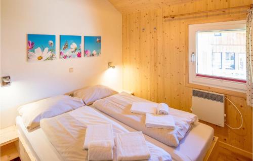 a bedroom with two beds with towels on them at Stunning Home In St,georgen A,kreischb, With 5 Bedrooms And Sauna in Sankt Lorenzen ob Murau