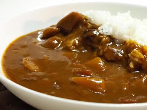 a bowl of food with meat and rice on a table at Hotel Kaguya in Himeji
