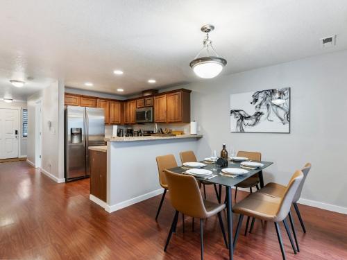 a kitchen and dining room with a table and chairs at No Place Like Home in Vancouver