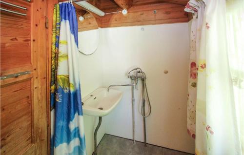 a bathroom with a sink and a shower at 3 Bedroom Beautiful Home In Samsø in Onsbjerg
