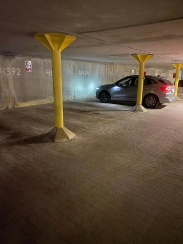 a car parked in a parking garage at night at Ploner villaggio Turistico in Dobbiaco
