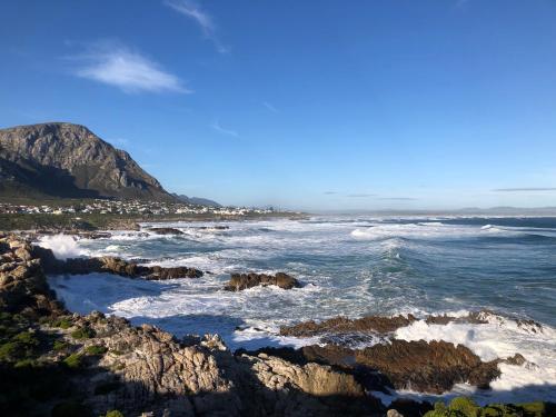 a view of the ocean from a rocky beach at Matshana Lodge in Hermanus