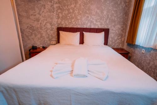 Postel nebo postele na pokoji v ubytování Ayasofya Hotel