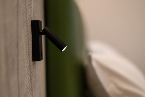 a black door handle on a wooden door at Hotel Lago Di Garda in Malcesine