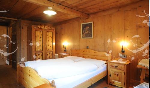 Postel nebo postele na pokoji v ubytování Glinzhof Mountain Natur Resort Agriturismo