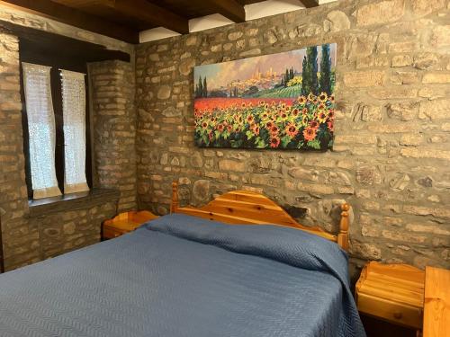 A bed or beds in a room at La Baita da Nino