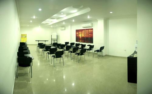 a large room with chairs and a table in it at Hotel Barrancabermeja Plaza in Barrancabermeja