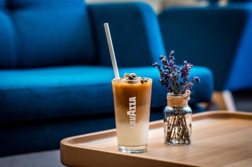 a drink sitting on top of a coffee table at Zámek Třešť in Třešť