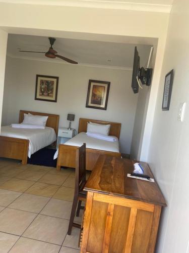 Postel nebo postele na pokoji v ubytování Botleng Guest House