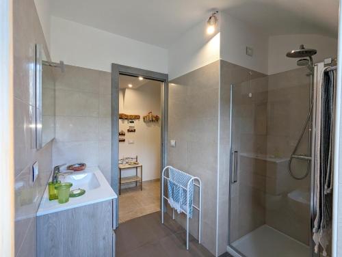 a bathroom with a sink and a shower at Le Due Macine in Ventimiglia