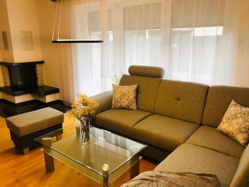 a living room with a couch and a coffee table at Appartement Ariane in Frastanz