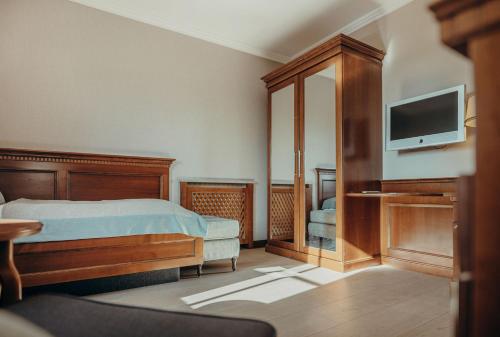 Postel nebo postele na pokoji v ubytování Wellness & Thermal Retreat Das Mühlbach