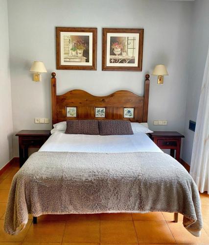 Postel nebo postele na pokoji v ubytování Hotel Ostau d'Òc