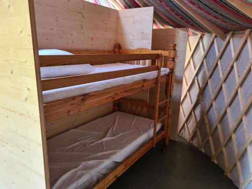 a bunk bed room with two bunk beds at Camping à la ferme - Hébergements insolites in Cerisy-la-Forêt