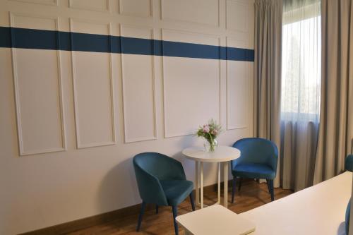 Postel nebo postele na pokoji v ubytování Hotel Torresi