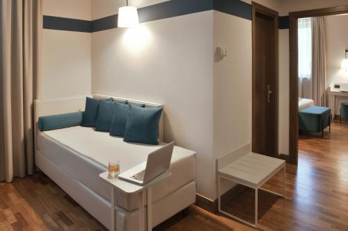 Postel nebo postele na pokoji v ubytování Hotel Torresi