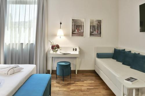 Postel nebo postele na pokoji v ubytování Hotel Torresi