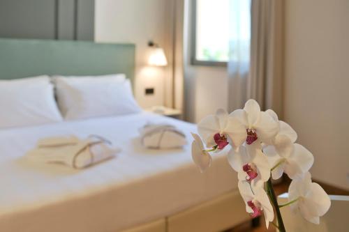 Postel nebo postele na pokoji v ubytování Hotel Torresi