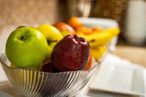 a bowl of fruit sitting on a table at Hotel Kandilj in Sarajevo