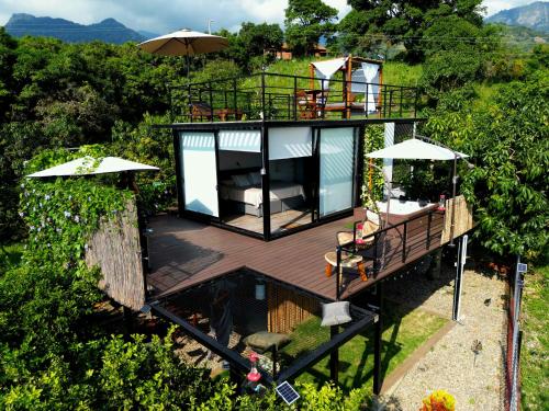 an overhead view of a house with a deck at Oasis Glamping Tena Cundinamarca Cerca a Bogotá in Tena