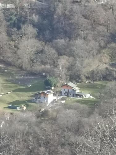 an aerial view of a house on a golf course at Baita Eleonora in Argegno