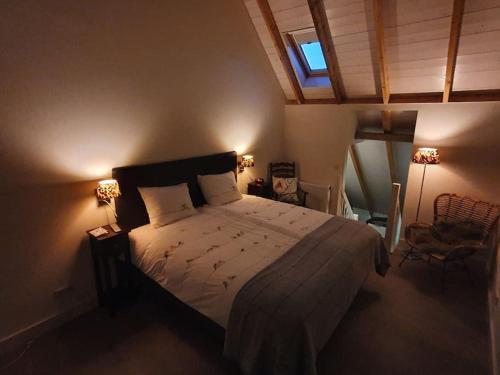 a bedroom with a large bed and a window at B&B Joostink in Vorden in Vorden
