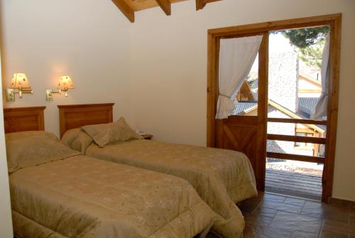 Un pat sau paturi într-o cameră la Ayelen Andina
