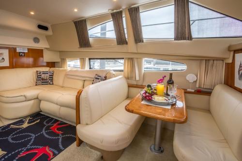 a living room in a boat with a table at Sea Pearl Boston Yacht in Boston