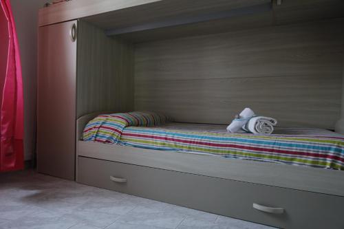 A bed or beds in a room at Cannotta Beach - Panarea