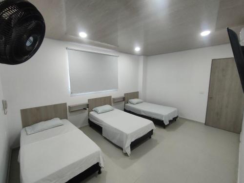 Postel nebo postele na pokoji v ubytování HOTEL MAR DEL CARIBE