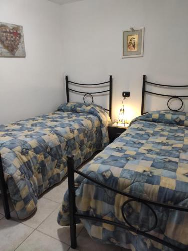 En eller flere senger på et rom på A Casa di Nonna