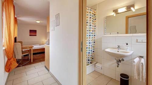 Ванна кімната в Fleiner Gästehaus