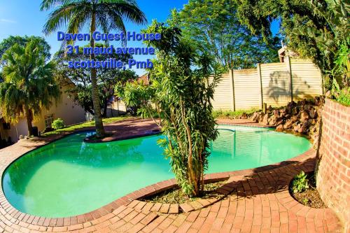 a swimming pool in front of a house at Daven Guest House (DGH) in Pietermaritzburg